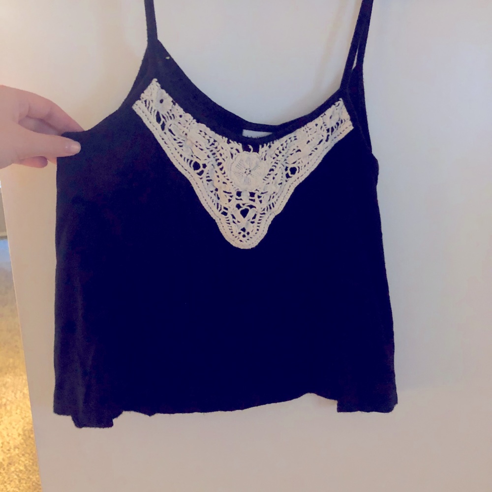 Black flowy top with white lace.